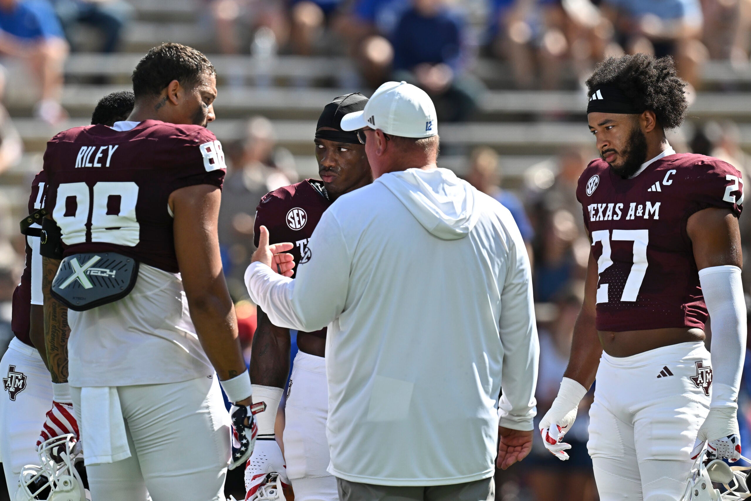 Sep 12, 2026; College Station, Texas, USA; Texas A&M Aggies head coach Mike Elko speaks with his captains prior to the game against Arizona State Sun Devils at Kyle Field.