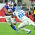 Sep 17, 2026; Orchard Park, New York, USA; Buffalo Bills wide receiver DJ Moore (2) runs against Detroit Lions linebacker Derrick Barnes (55) during the first half at New Highmark Stadium.