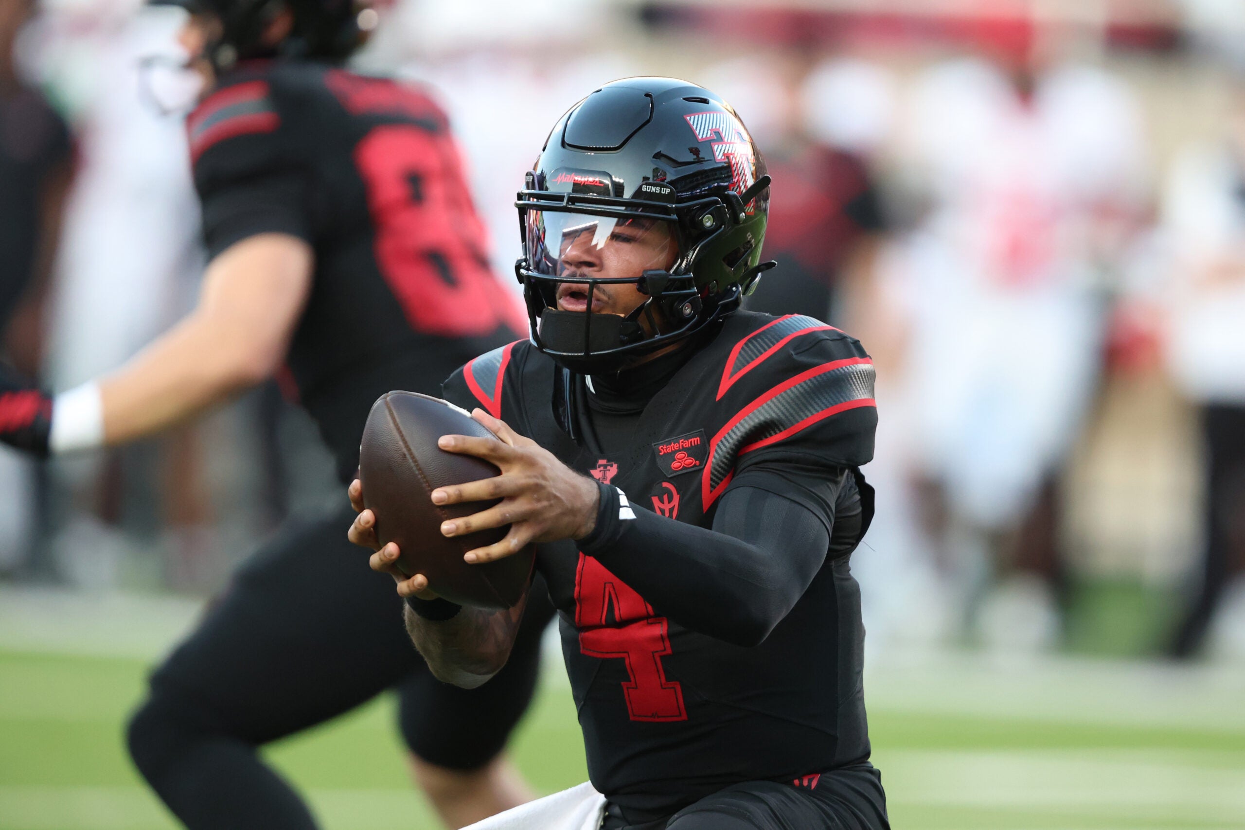 Sep 18, 2026; Lubbock, Texas, USA; Texas Tech Red Raiders quarterback Thomas Castellanos (4) takes a snap from center against the Houston Cougars in the first half at Galaxy Stadium.