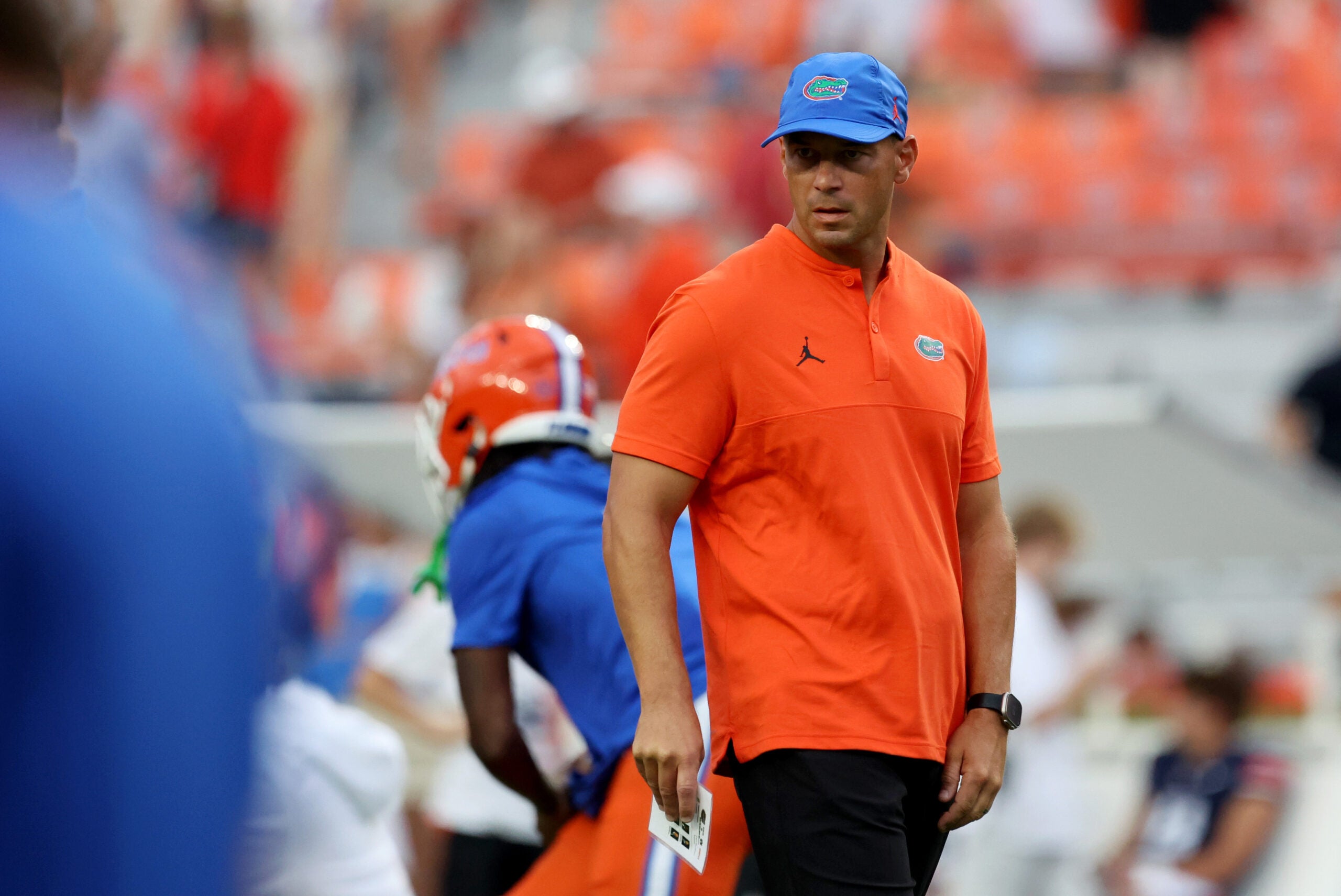 Sep 19, 2026; Auburn, Alabama, USA; Florida Gators head coach Jon Sumrall watches his team warm up before the game against the Auburn Tigers at Jordan-Hare Stadium.