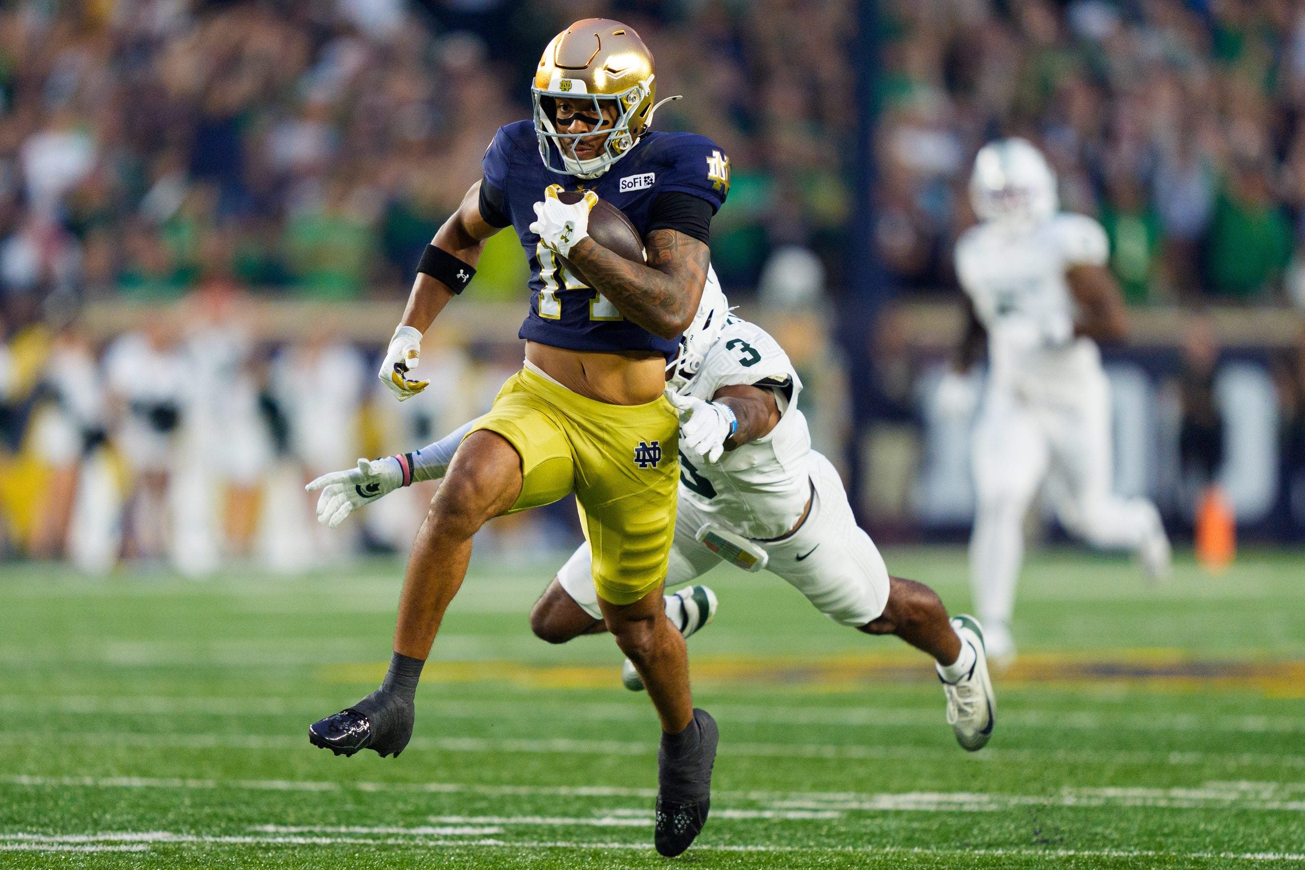Notre Dame wide receiver Micah Gilbert (14) rushes the ball during a NCAA football game against Michigan State at Notre Dame Stadium on Saturday, Sept. 19, 2026, in South Bend.