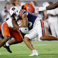 Sep 19, 2026; Auburn, Alabama, USA; Florida Gators linebacker Myles Graham (5) tackles Auburn Tigers running back Jeremiah Cobb (23) during the third quarter at Jordan-Hare Stadium.
