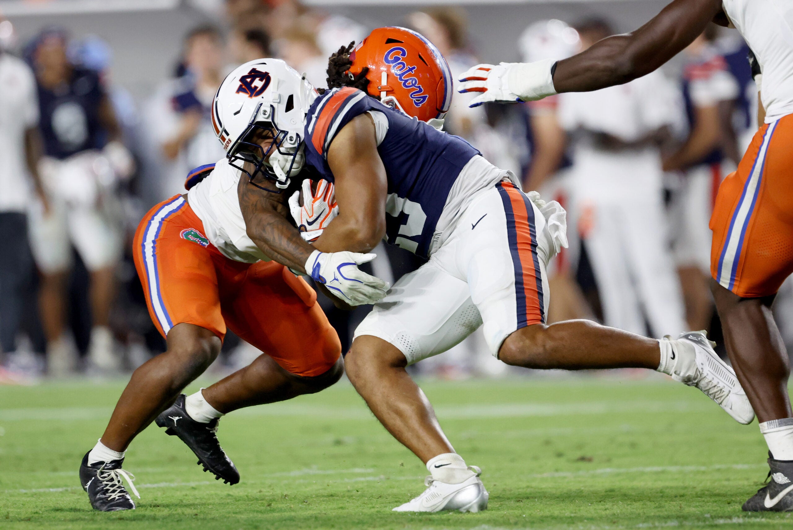 Sep 19, 2026; Auburn, Alabama, USA; Florida Gators linebacker Myles Graham (5) tackles Auburn Tigers running back Jeremiah Cobb (23) during the third quarter at Jordan-Hare Stadium.