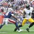 Sep 20, 2026; Foxborough, Massachusetts, USA; Pittsburgh Steelers wide receiver DK Metcalf (4) runs the ball against New England Patriots safety Craig Woodson (4) in the first half at Gillette Stadium.