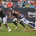 Sep 20, 2026; Chicago, Illinois, USA; Chicago Bears quarterback Caleb Williams (18) scrambles against Minnesota Vikings linebacker Eric Wilson (55) during the first half at Soldier Field.