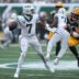 Sep 20, 2026; East Rutherford, New Jersey, USA; Green Bay Packers defensive end Lukas Van Ness (90) applies the pressure on New York Jets quarterback Geno Smith (7) during the third quarter at MetLife Stadium.