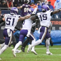 Sep 20, 2026; Chicago, Illinois, USA; Minnesota Vikings linebacker Dallas Turner (obscured) celebrates with linebacker Blake Cashman (51) and quarterback J.J. McCarthy (9) after sacking Chicago Bears quarterback Tyson Bagent (not pictured) to end the game in the second half at Soldier Field.