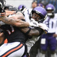 Sep 20, 2026; Chicago, Illinois, USA; Minnesota Vikings linebacker Dallas Turner (15) sacks Chicago Bears quarterback Tyson Bagent (17) to end the game in the second half at Soldier Field.