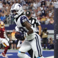 Sep 20, 2026; Arlington, Texas, USA; Dallas Cowboys wide receiver CeeDee Lamb (88) reacts after catching a three-yard touchdown pass thrown by quarterback Dak Prescott (not pictured) against the Washington Commanders during the first quarter at AT&T Stadium.