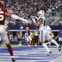 Sep 20, 2026; Arlington, Texas, USA; Dallas Cowboys tight end Jake Ferguson (87) catches a ten-yard touchdown pass thrown by quarterback Dak Prescott (not pictured) against the Washington Commanders during the first half at AT&T Stadium.