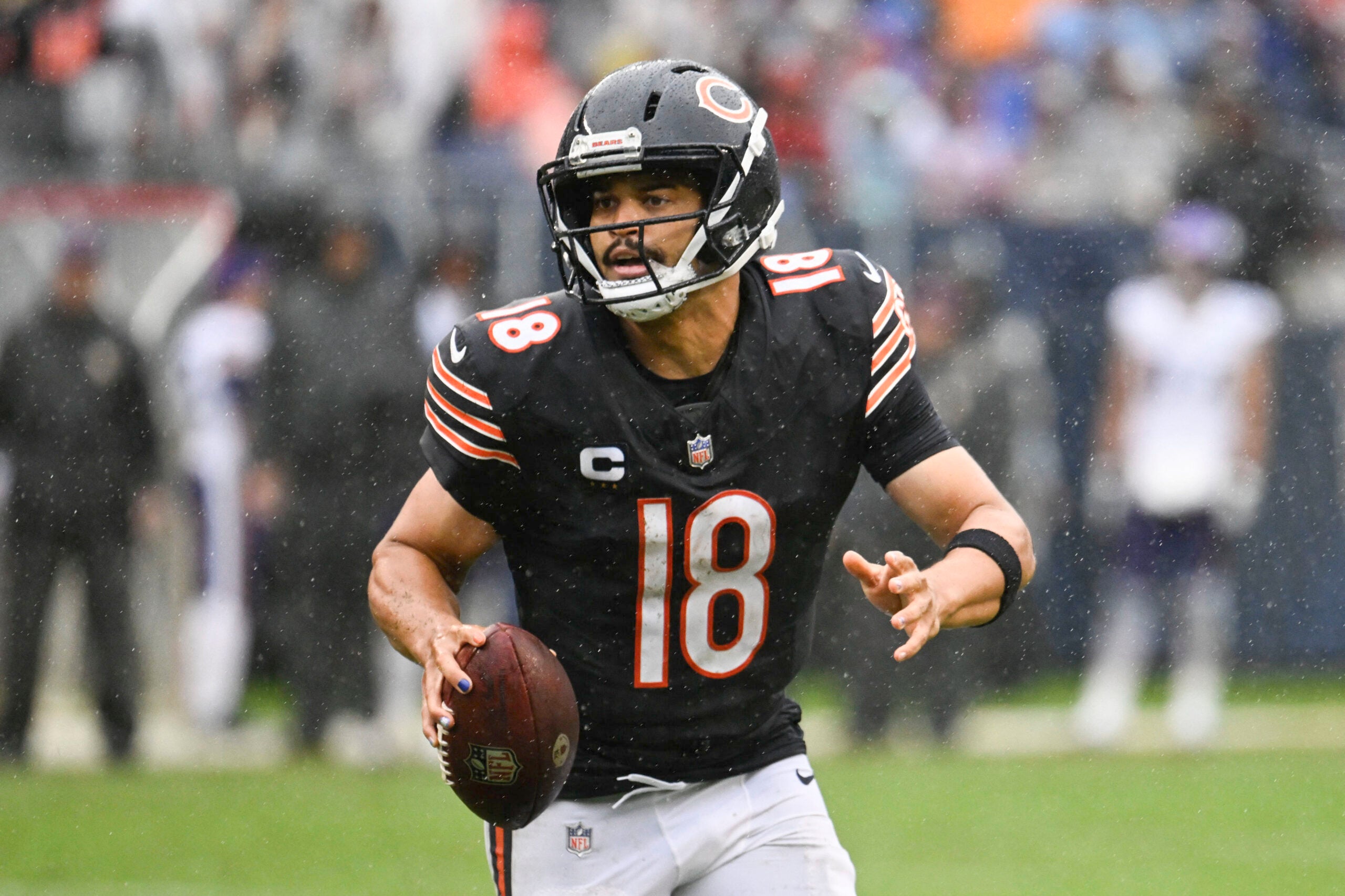 Sep 20, 2026; Chicago, Illinois, USA; Chicago Bears quarterback Caleb Williams (18) scrambles against the Minnesota Vikings during the second half at Soldier Field.