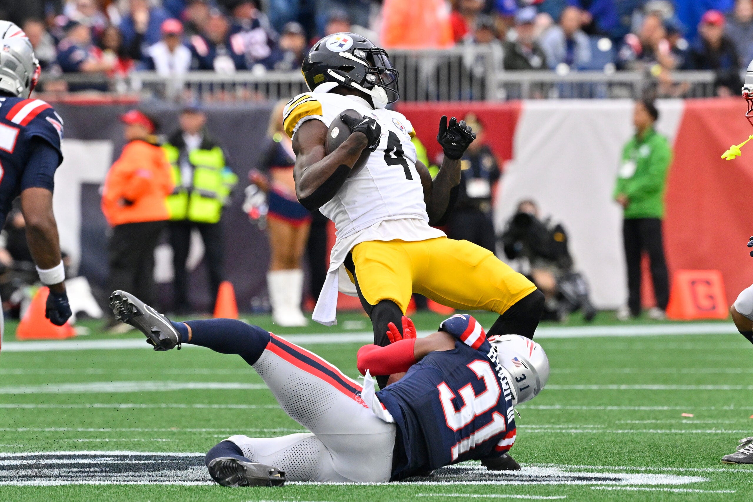 September 20, 2026; Foxborough, Massachusetts, USA; New England Patriots safety Kevin Byard III (31) tackles Pittsburgh Steelers wide receiver DK Metcalf (4) during the second half at Gillette Stadium.