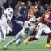 Sep 20, 2026; Arlington, Texas, USA; Washington Commanders quarterback Marcus Mariota (8) scrambles against Dallas Cowboys linebacker Donovan Ezeiruaku (6) during the fourth quarter at AT&T Stadium.