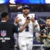 Sep 20, 2026; Arlington, Texas, USA; Dallas Cowboys quarterback Dak Prescott (4) jogs off the field and reacts for an NFL social media creator after a game against the Washington Commanders at AT&T Stadium.