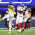 Sep 21, 2026; Inglewood, California, USA; New York Giants safety Jevon Holland (8) makes an interception against Los Angeles Rams wide receiver Davante Adams (17) during the second quarter at SoFi Stadium.
