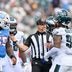 Sep 20, 2026; Nashville, Tennessee, USA; Referee Clay Martin talks with Philadelphia Eagles defensive tackle Jalen Carter (98) and Tennessee Titans offensive tackle JC Latham (55) during a time out during the second half at Nissan Stadium.