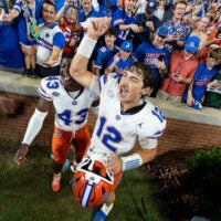 Florida Gators quarterback Aaron Philo (12) celebrates with fans after the game as Auburn Tigers take on Florida Gators at Jordan-Hare Stadium in Auburn, Ala. on Saturday, Sept. 19, 2026. Florida Gators defeated Auburn Tigers 44-39.