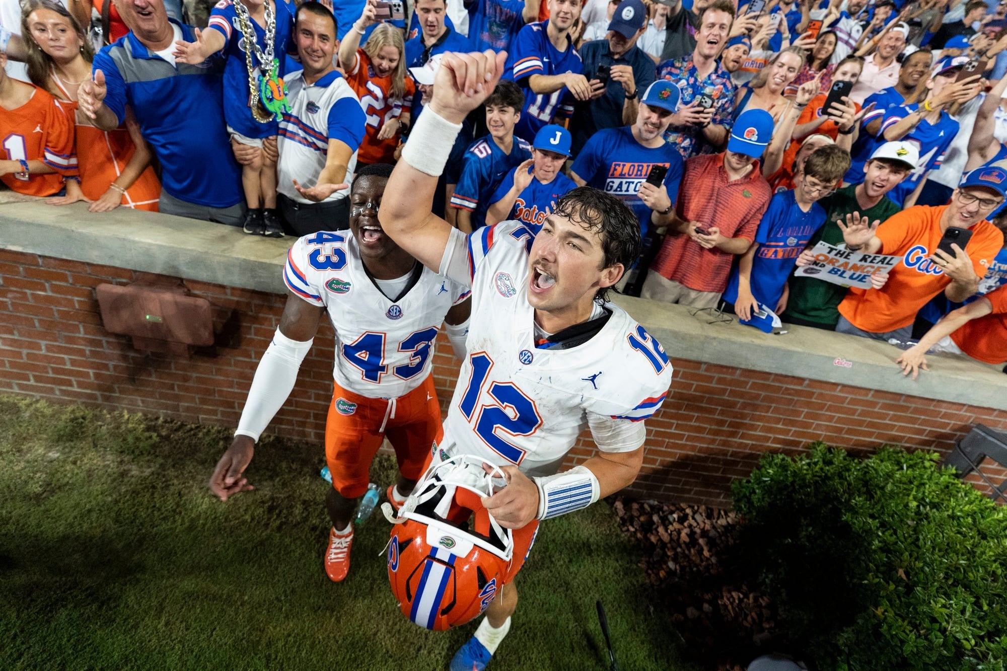 Florida Gators quarterback Aaron Philo (12) celebrates with fans after the game as Auburn Tigers take on Florida Gators at Jordan-Hare Stadium in Auburn, Ala. on Saturday, Sept. 19, 2026. Florida Gators defeated Auburn Tigers 44-39.