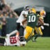 Sep 24, 2026; Green Bay, Wisconsin, USA; Atlanta Falcons defensive end Cameron Thomas (99) tackles Green Bay Packers quarterback Jordan Love (10) during the third quarter at Lambeau Field.