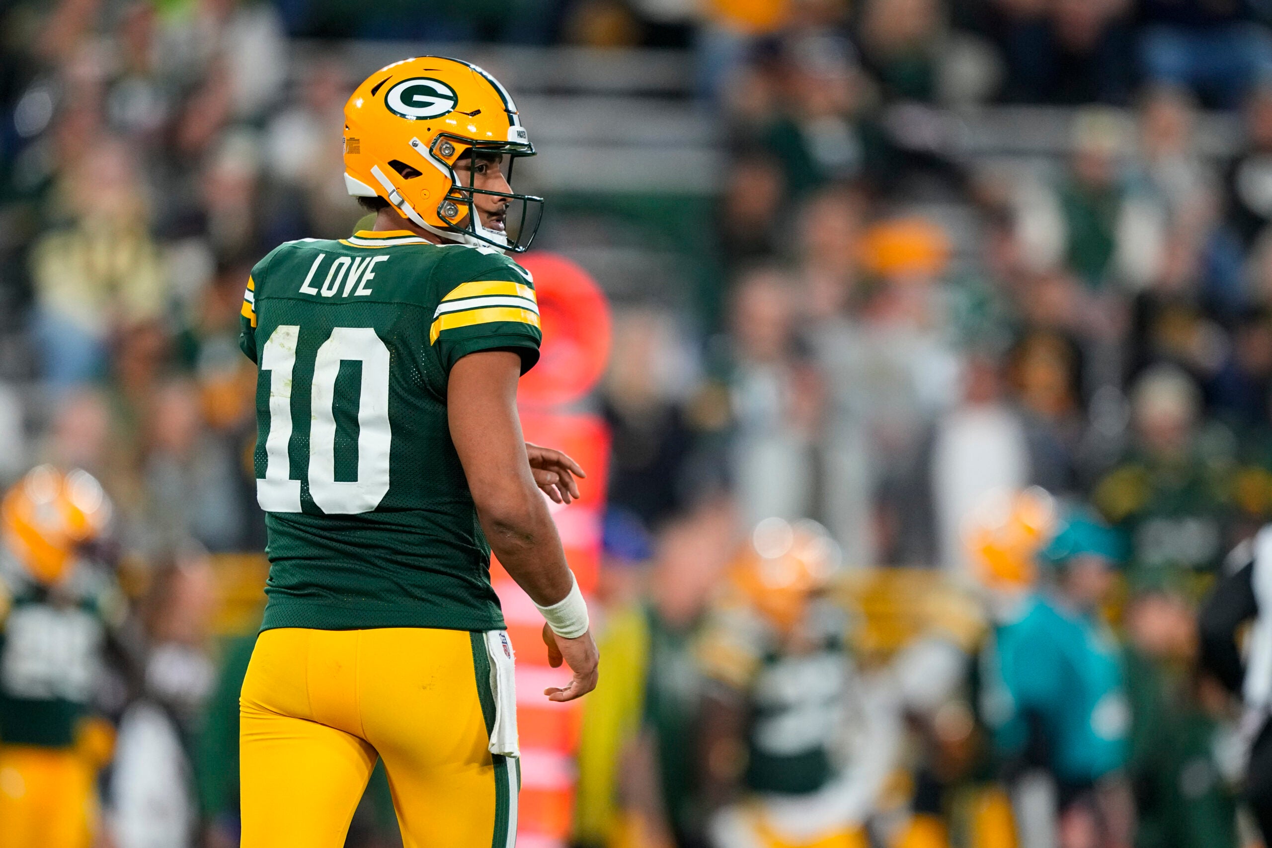 Sep 24, 2026; Green Bay, Wisconsin, USA; Green Bay Packers quarterback Jordan Love (10) looks on following a play during the fourth quarter against the Atlanta Falcons at Lambeau Field.