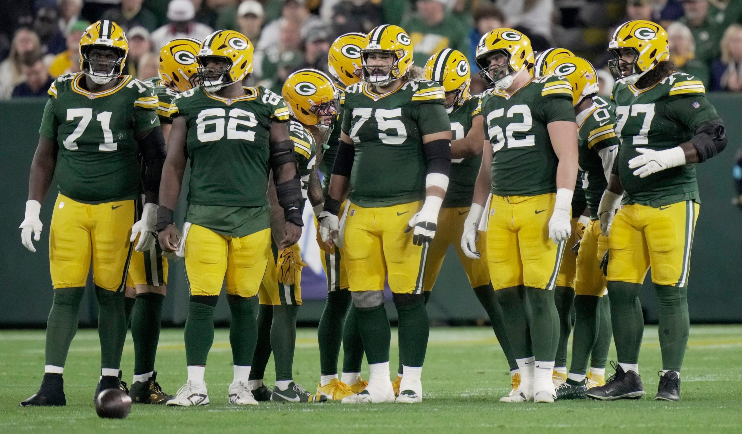 Green Bay Packers offensive tackle Anthony Belton (71), center Jacob Monk (62), guard Sean Rhyan (75), Jacob Monk (62) and guard Jordan Morgan (77) are shown during the first quarter of their game against the Atlanta Falcons Thursday, Sept. 24, 2026 at Lambeau Field in Green Bay, Wisconsin.