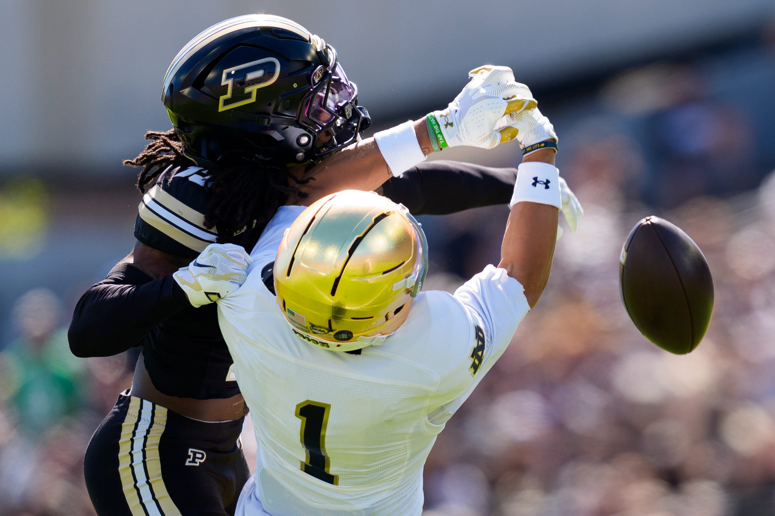 Purdue defensive back John Slaughter, left, interrupts a pass intended for Notre Dame wide receiver Jaden Greathouse (1) during a NCAA football game at Ross-Ade Stadium on Saturday, Sept. 26, 2026, in West Lafayette.