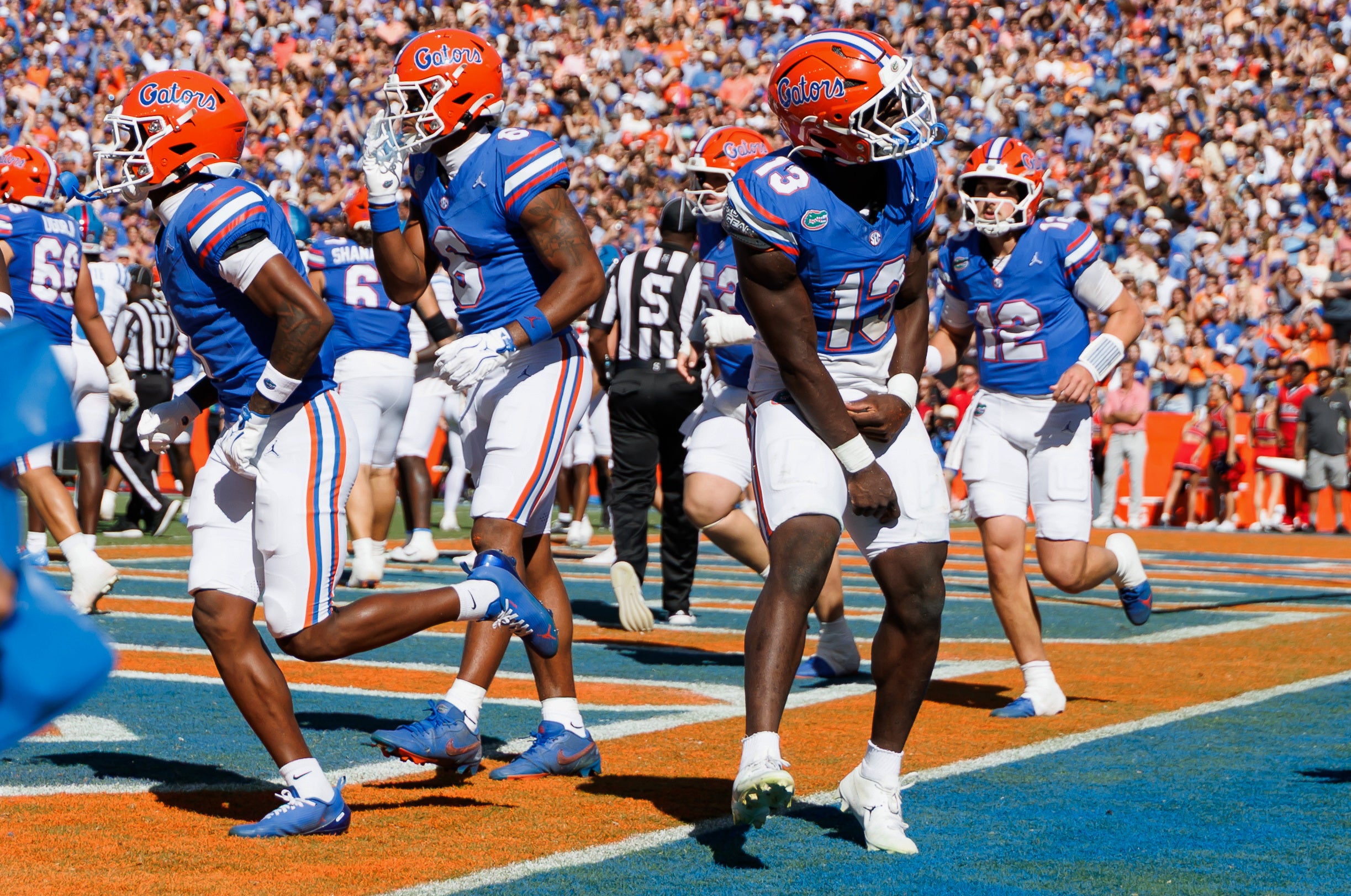 Sep 26, 2026; Gainesville, Florida, USA; Florida Gators running back Jadan Baugh (13) reacts after scoring a touchdown against the Mississippi Rebels during the first half at Ben Hill Griffin Stadium.