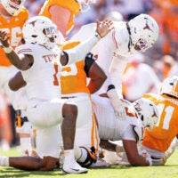 Texas defensive lineman Colin Simmons (1) celebrates after a sack of Tennessee quarterback Faizon Brandon (11) during their game at Neyland Stadium in Knoxville, Tenn. on Sept. 26, 2026.