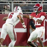 Sep 26, 2026; Tuscaloosa, AL, USA; Alabama quarterback Keelon Russell (12) makes a sidearm throw around South Carolina edge rusher Dylan Stewart (6) at Saban Field at Bryant Denny Stadium.