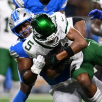 New York Jets' star receiver Garrett Wilson took a hit to the head against the Lions but cleared concussion protocol.