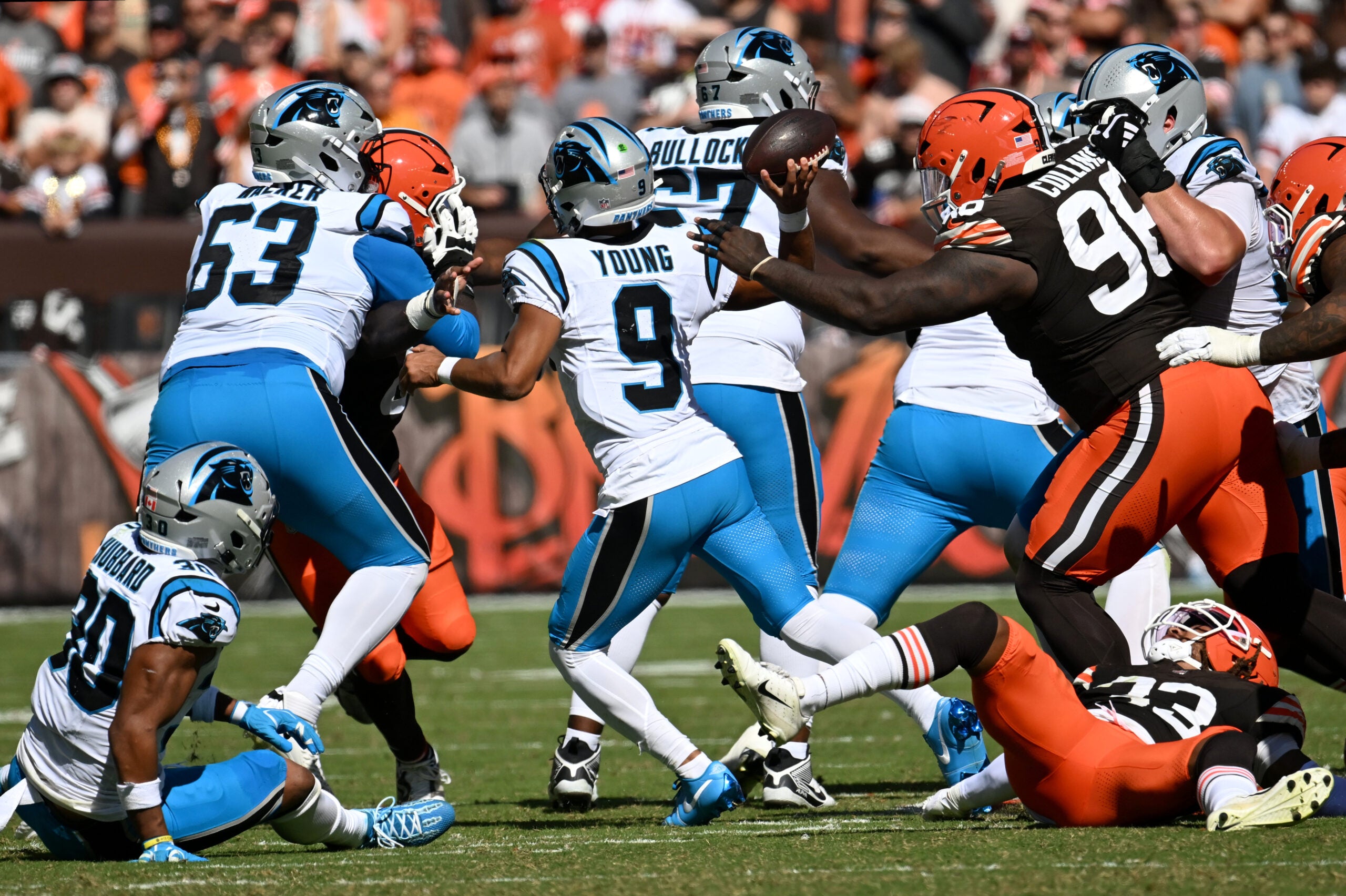 Sep 27, 2026; Cleveland, Ohio, USA; Carolina Panthers quarterback Bryce Young (9) passes the ball under pressure from Cleveland Browns defensive tackle Maliek Collins (96) during the second quarter at Huntington Bank Field.
