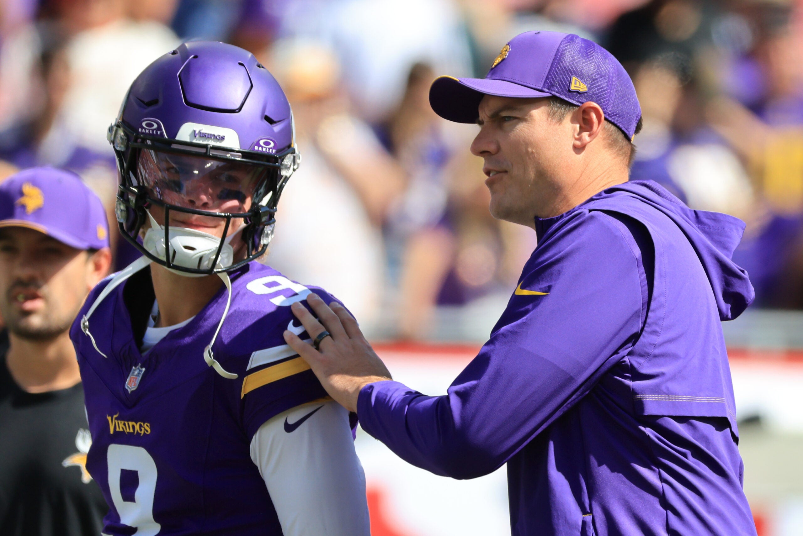 Sep 27, 2026; Tampa, Florida, USA; Minnesota Vikings head coach Kevin O'Connell greets quarterback J.J. McCarthy (9) during warmups prior to the game against the Tampa Bay Buccaneers at Raymond James Stadium.