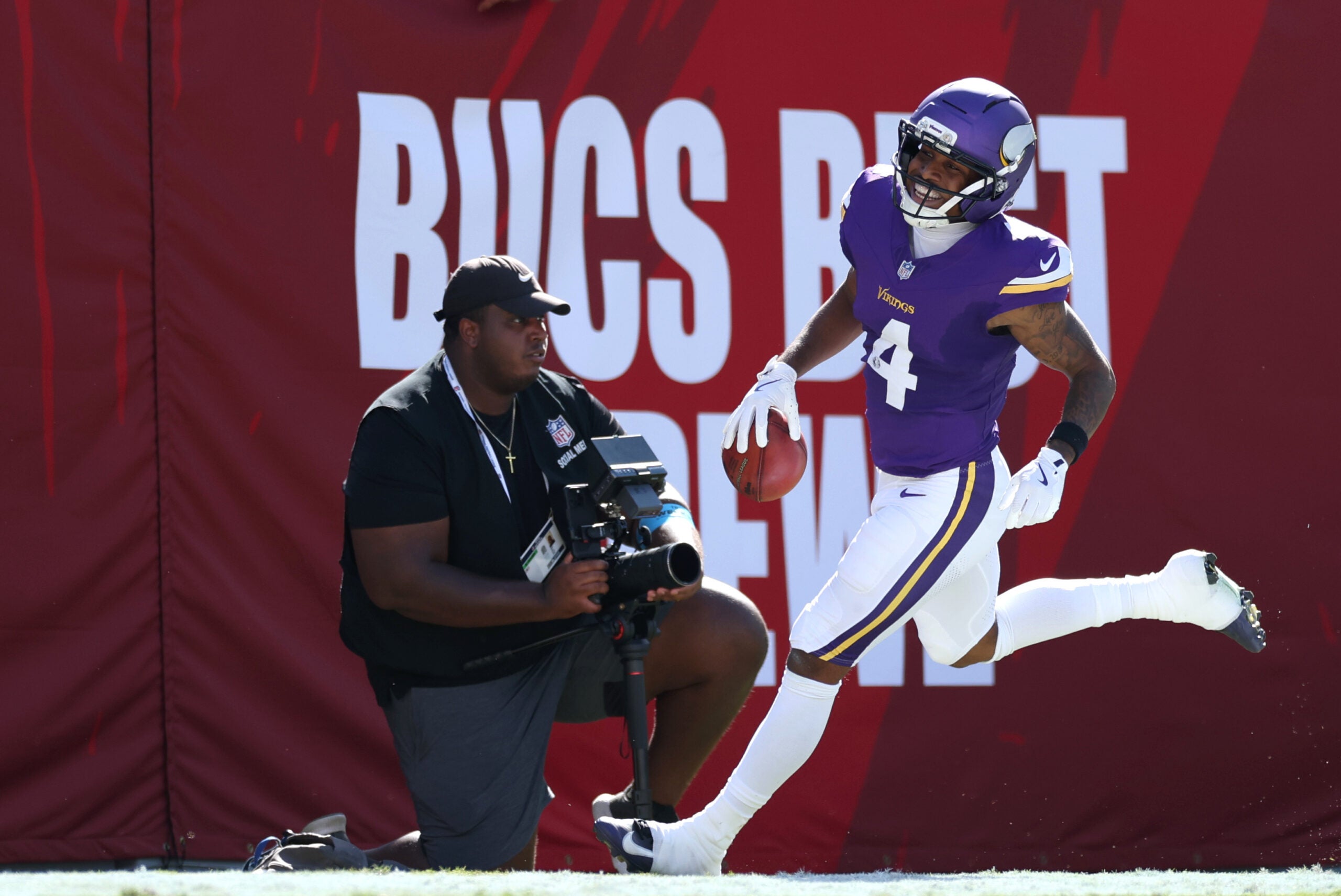 Sep 27, 2026; Tampa, Florida, USA; Minnesota Vikings wide receiver Myles Price (4) celebrates after returning a punt for a touchdown against the Tampa Bay Buccaneers during the first quarter at Raymond James Stadium.