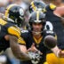 Pittsburgh Steelers quarterback Aaron Rodgers (8) pitches to running back Jaylen Warren (30) in the fourth quarter of the NFL Week 3 game between the Pittsburgh Steelers and the Cincinnati Bengals at Acrisure Stadium in Pittsburgh on Sunday, Sept. 27, 2026. The Bengals fell to 2-1 on the season with a 30-27 loss on the road.