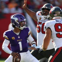Sep 27, 2026; Tampa, Florida, USA; Minnesota Vikings quarterback Kyler Murray (1) under pressure from Tampa Bay Buccaneers nose tackle Vita Vea (50) and linebacker Anthony Nelson (98) during the second quarter at Raymond James Stadium.