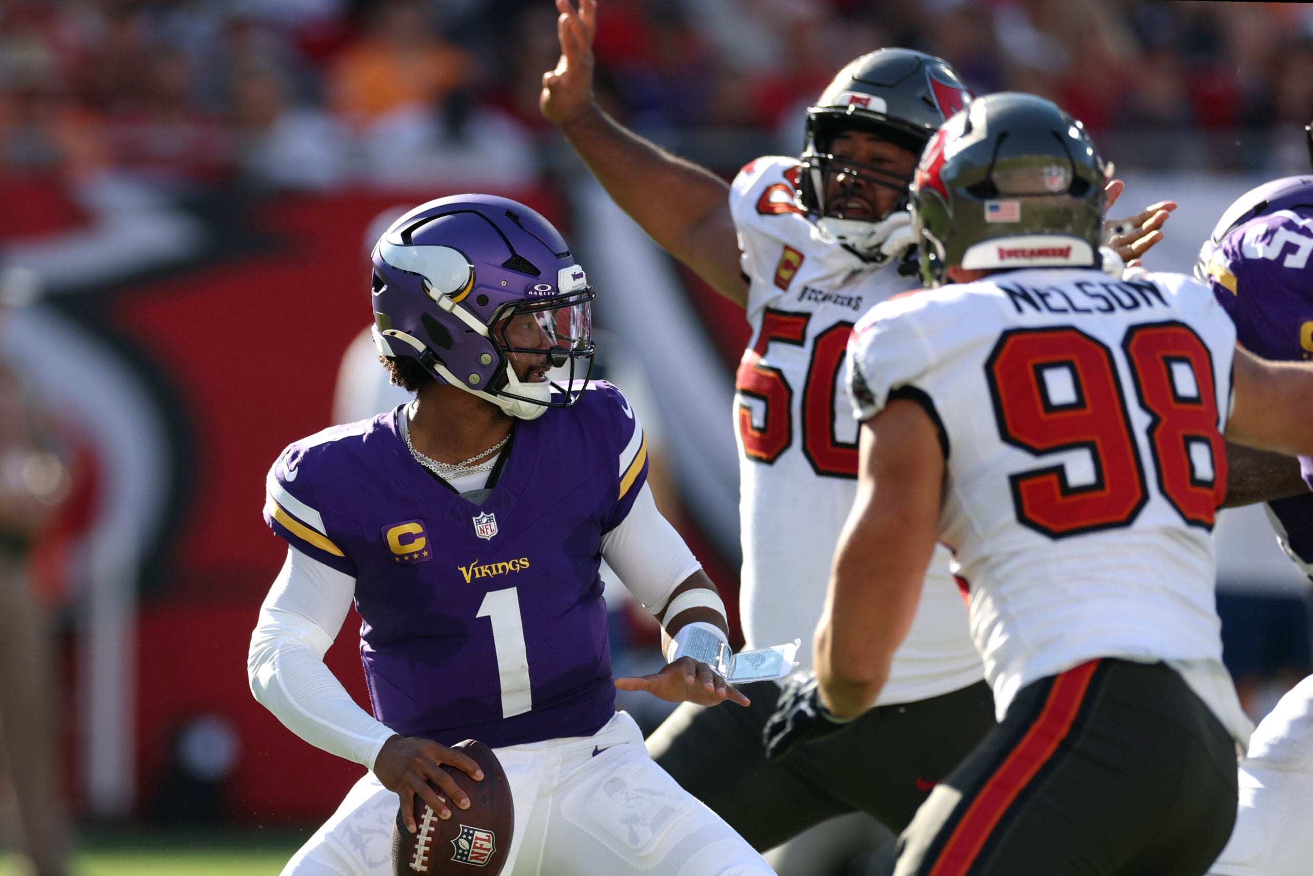 Sep 27, 2026; Tampa, Florida, USA; Minnesota Vikings quarterback Kyler Murray (1) under pressure from Tampa Bay Buccaneers nose tackle Vita Vea (50) and linebacker Anthony Nelson (98) during the second quarter at Raymond James Stadium.