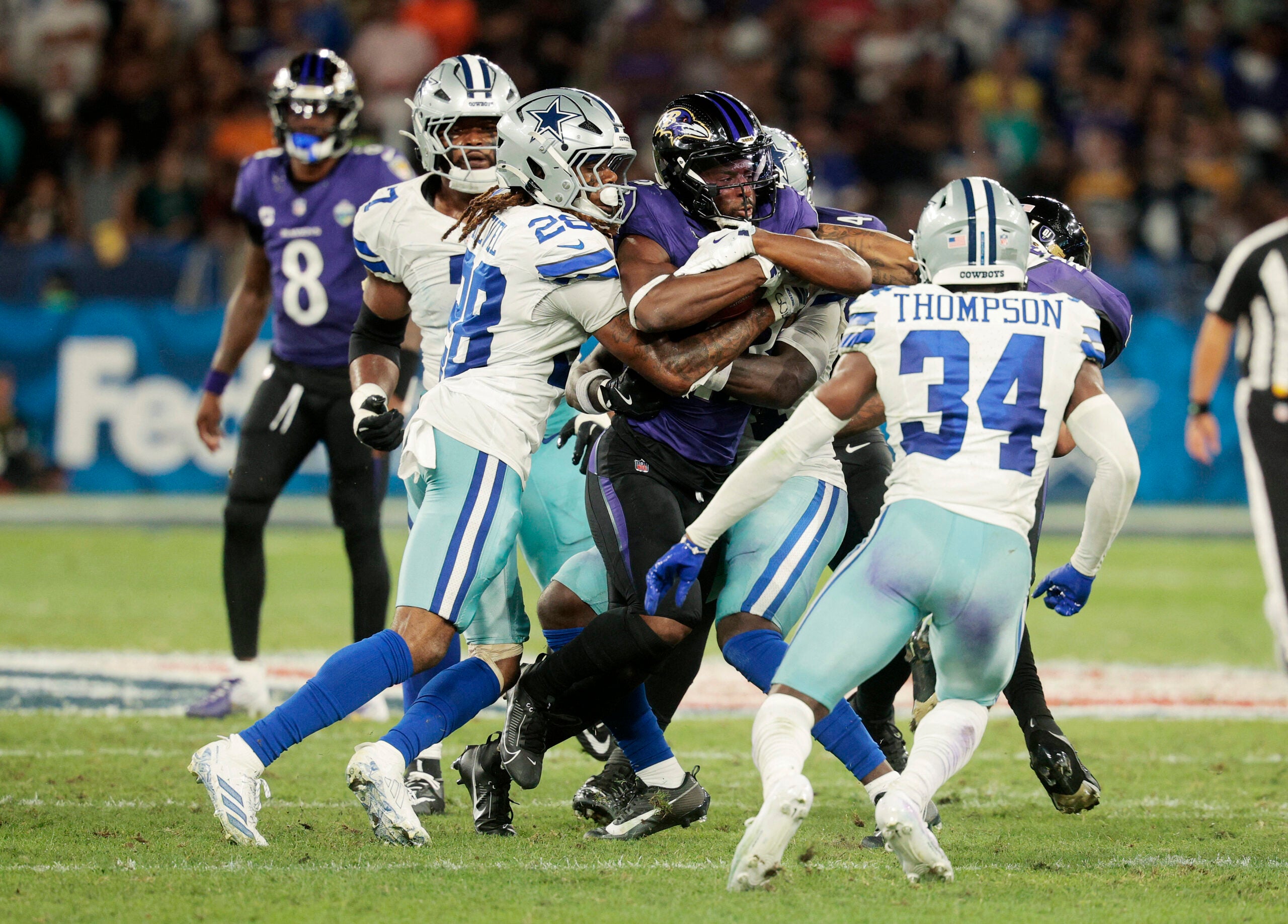 Football - NFL - Baltimore Ravens v Dallas Cowboys - Estadio Maracana, Rio de Janeiro, Brazil - September 27, 2026 Baltimore Ravens' Justice Hill in action with Dallas Cowboys' Shavon Revel Jr.