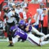 Sep 27, 2026; Tampa, Florida, USA; Tampa Bay Buccaneers running back Bucky Irving (7) carries the ball defended by Minnesota Vikings linebacker Kyle Van Noy (17) and safety Harrison Smith (22) during the third quarter at Raymond James Stadium.