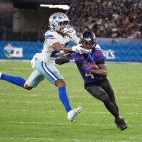 Sep 27, 2026; Rio De Janeiro, BRA; Baltimore Ravens wide receiver Zay Flowers (4) is tackled by Dallas Cowboys cornerback Shavon Revel Jr. (28) during the game at Maracana Stadium.