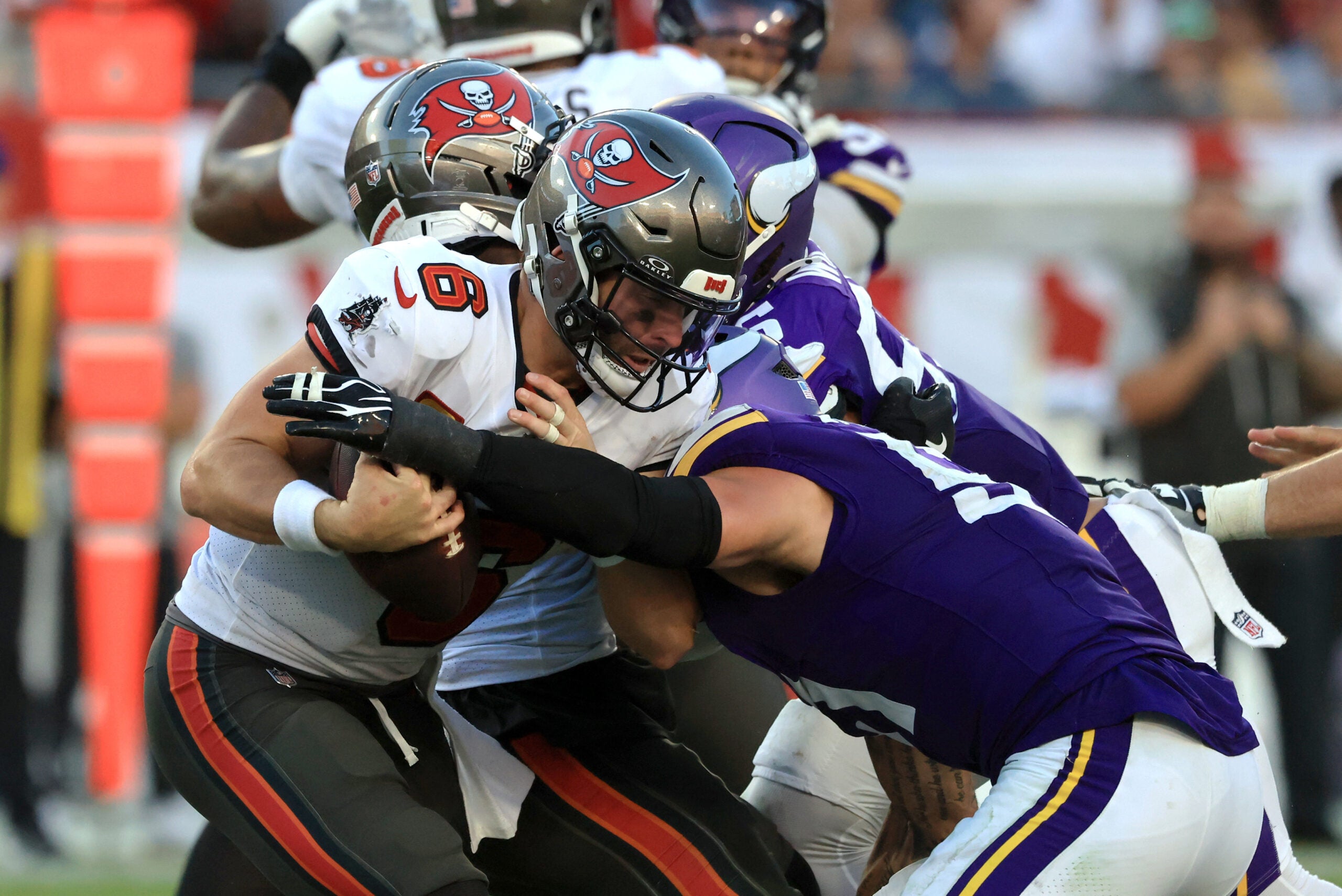 Sep 27, 2026; Tampa, Florida, USA; Minnesota Vikings linebacker Blake Cashman (51) tackles Tampa Bay Buccaneers quarterback Baker Mayfield (6) during the fourth quarter at Raymond James Stadium.