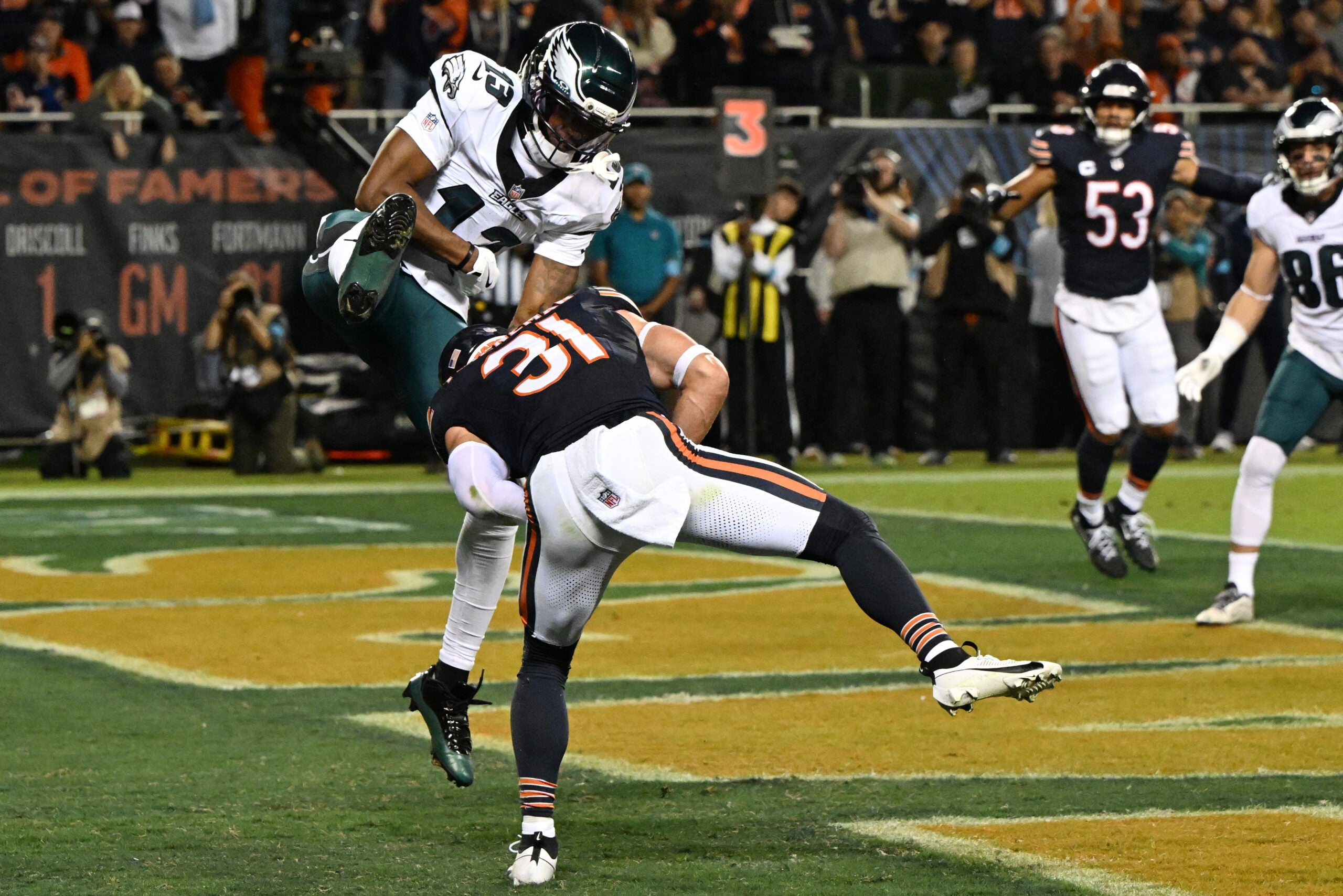 Sep 28, 2026; Chicago, Illinois, USA; Chicago Bears safety Dillon Thieneman (31) intercepts the ball against Philadelphia Eagles wide receiver Dontayvion Wicks (13) during the first half at Soldier Field.