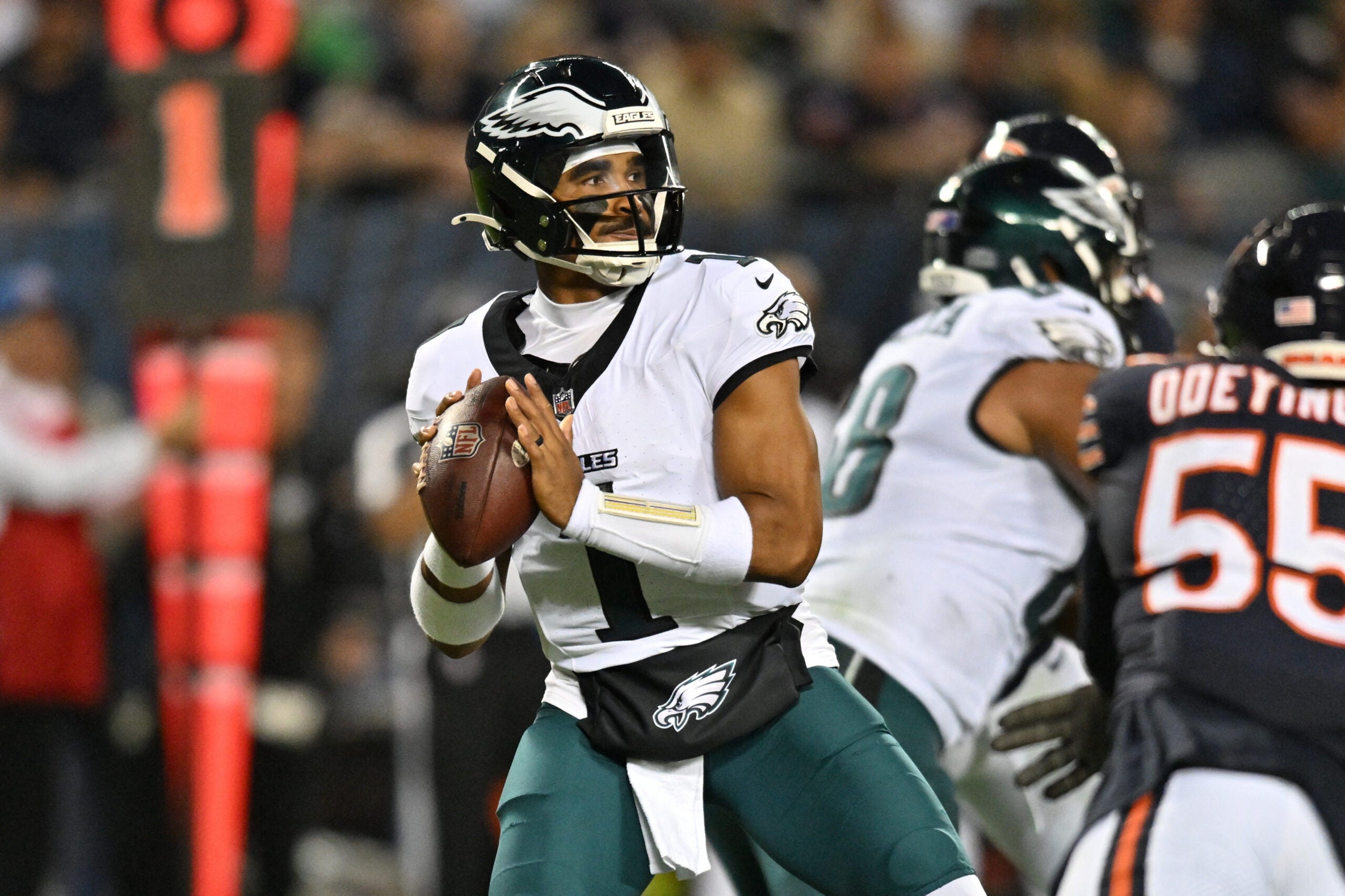 Sep 28, 2026; Chicago, Illinois, USA; Philadelphia Eagles quarterback Jalen Hurts (1) looks to pass against the Chicago Bears during the first half at Soldier Field.