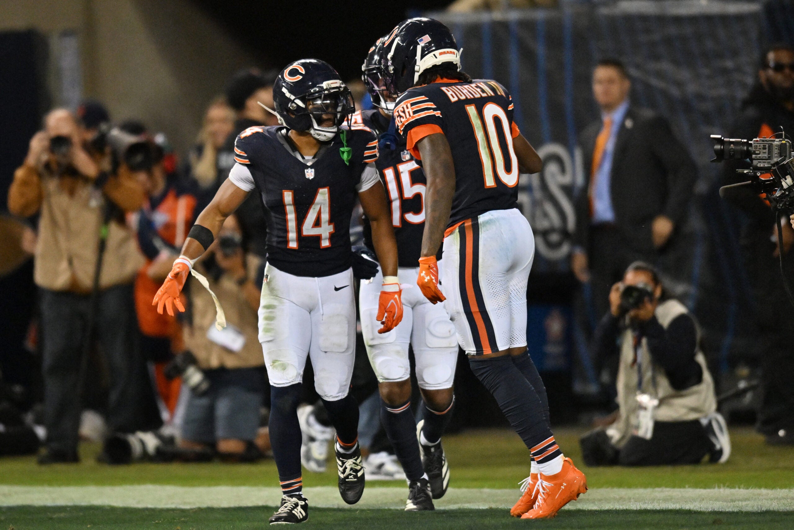 Sep 28, 2026; Chicago, Illinois, USA; Chicago Bears wide receiver Kalif Raymond (14) celebrates with wide receiver Luther Burden III (10) after scoring a touchdown against the Philadelphia Eagles during the second half at Soldier Field.