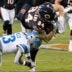 Jan 4, 2026; Chicago, Illinois, USA; Detroit Lions safety Jalen Mills (13) tackles Chicago Bears tight end Colston Loveland (84) during the first half at Soldier Field.
