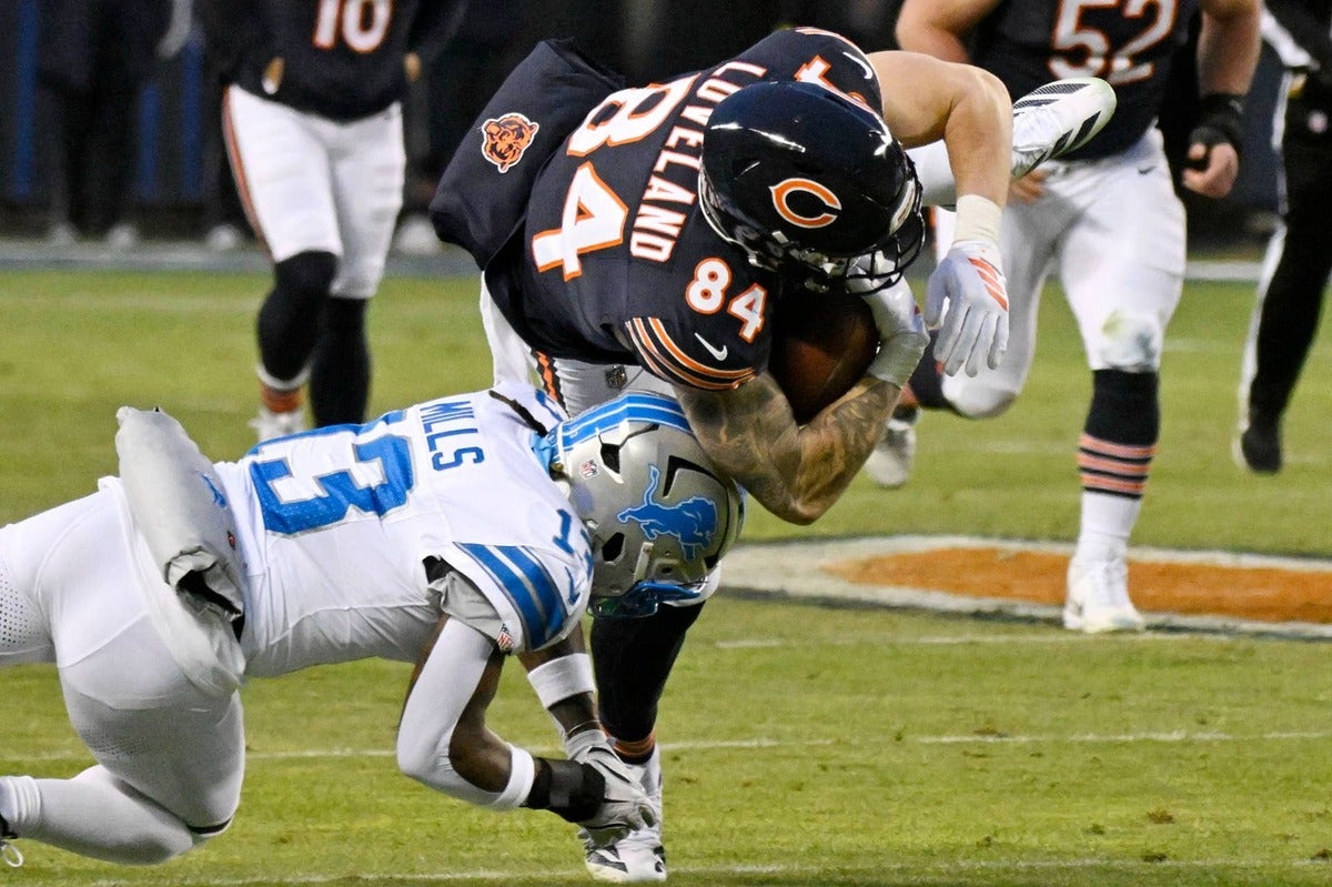 Jan 4, 2026; Chicago, Illinois, USA; Detroit Lions safety Jalen Mills (13) tackles Chicago Bears tight end Colston Loveland (84) during the first half at Soldier Field.