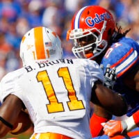 September 19, 2009; Gainesville FL, USA; Florida Gators linebacker Brandon Spikes (51) tackles Tennessee Volunteers running back Bryce Brown (11) during the first half at Ben Hill Griffin Stadium.