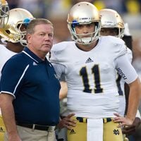 Sep 7, 2013; Ann Arbor, MI, USA; Notre Dame Fighting Irish head coach Brian Kelly talks with quarterback Tommy Rees (11) during warmups before the game against the Michigan Wolverines at Michigan Stadium. Michigan won 41-30.