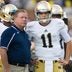Sep 7, 2013; Ann Arbor, MI, USA; Notre Dame Fighting Irish head coach Brian Kelly talks with quarterback Tommy Rees (11) during warmups before the game against the Michigan Wolverines at Michigan Stadium. Michigan won 41-30.
