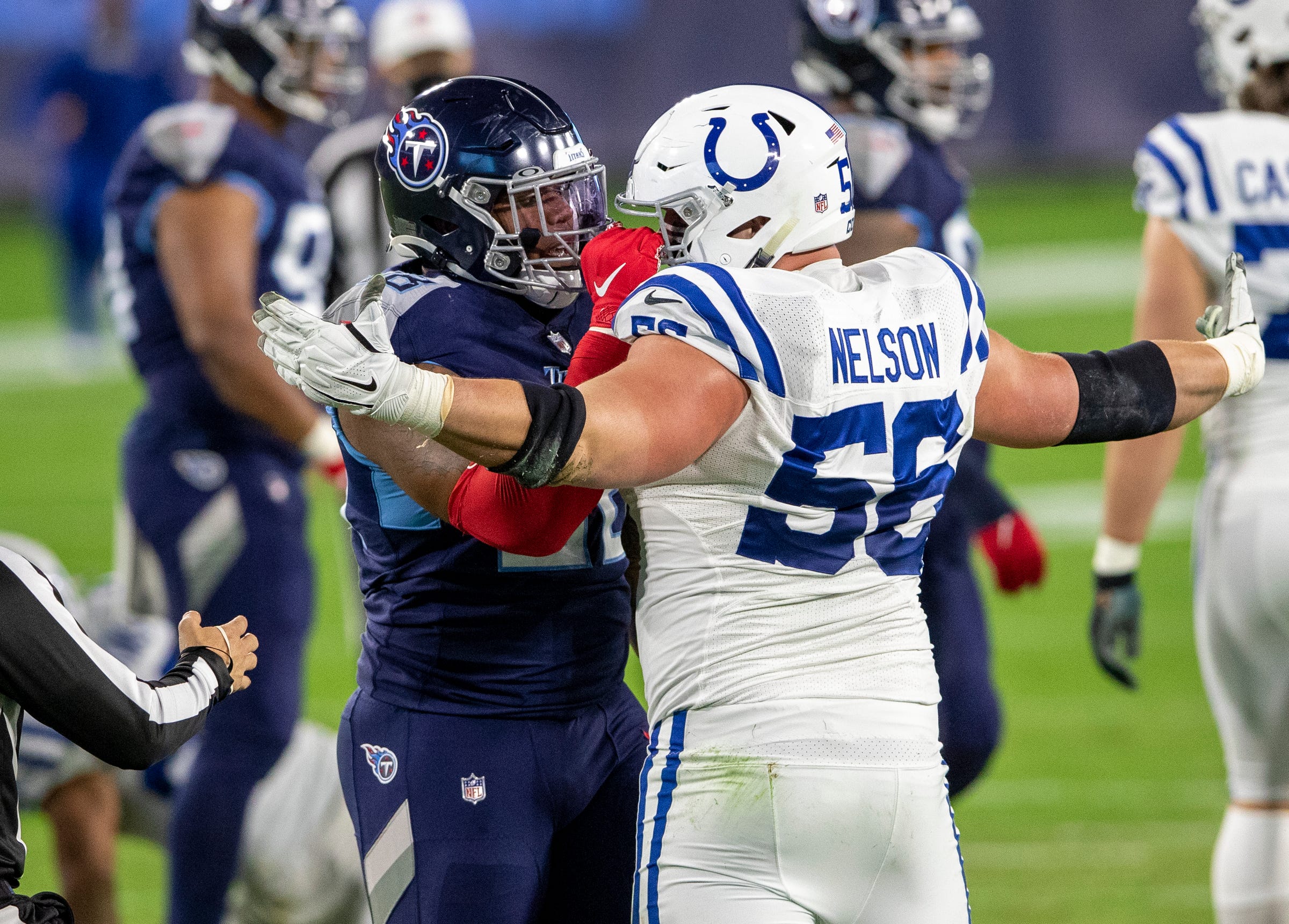 Quenton Nelson (56) of the Indianapolis Colts has a disagreement with Jeffery Simmons (98) of the Tennessee Titans after a physical play, Indianapolis Colts at Tennessee Titans, Nissan Stadium, Nashville, Thursday, Nov. 12, 2020.
