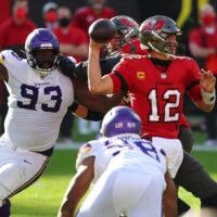 Dec 13, 2020; Tampa, Florida, USA; Tampa Bay Buccaneers quarterback Tom Brady (12) throws a pass as Minnesota Vikings defensive tackle Shamar Stephen (93) defends during the second half at Raymond James Stadium.